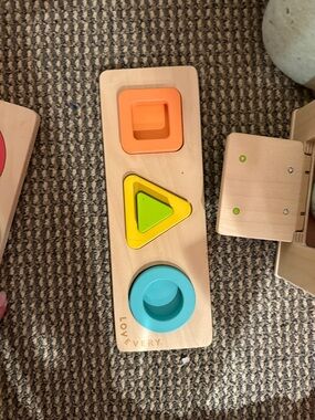 Lovevery Wooden Shape Sorting Board in Orange, Yellow, Green, Blue